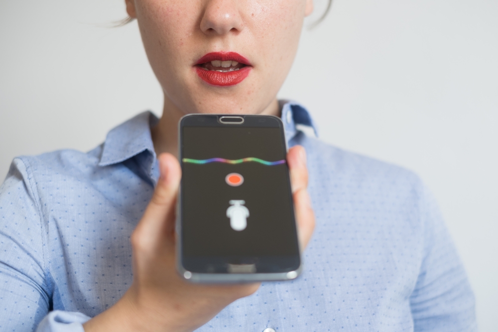 woman using voice assistant